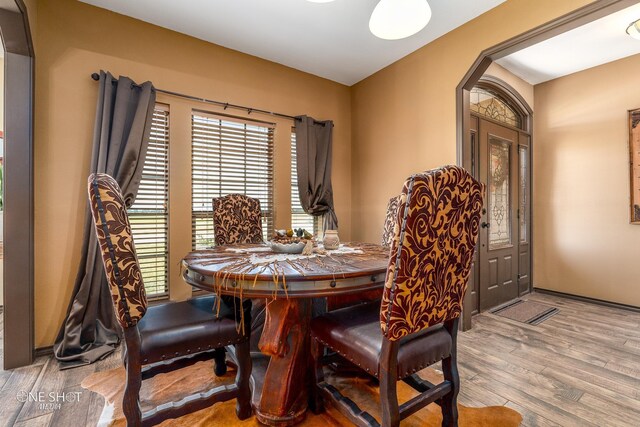 dining room with light hardwood / wood-style flooring