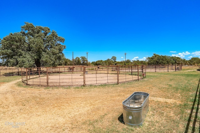 view of yard with a rural view