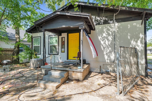 rear view of property with central air condition unit