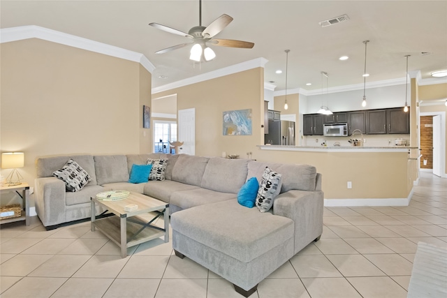 living room with ceiling fan, ornamental molding, and light tile patterned floors