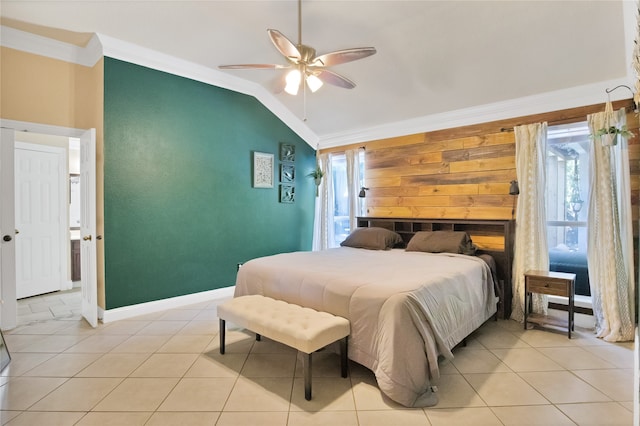 tiled bedroom with ceiling fan, vaulted ceiling, and ornamental molding