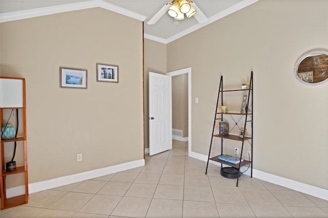 interior space featuring light tile patterned flooring, ornamental molding, and ceiling fan