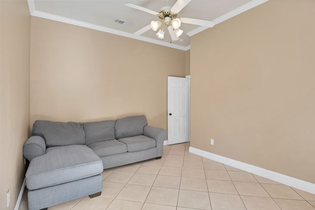 tiled living room featuring ceiling fan and crown molding