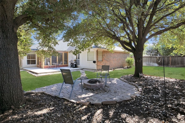 view of yard featuring a patio area and a fire pit