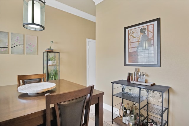 tiled dining area with crown molding