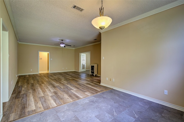 spare room with tile patterned flooring, ceiling fan, a textured ceiling, and ornamental molding