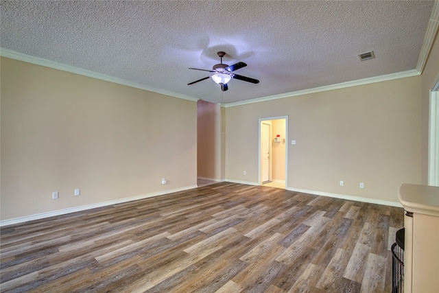 spare room featuring hardwood / wood-style flooring, ornamental molding, a textured ceiling, and ceiling fan