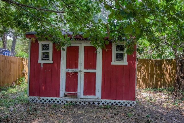 view of shed featuring a fenced backyard