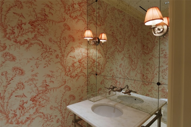 bathroom featuring wallpapered walls