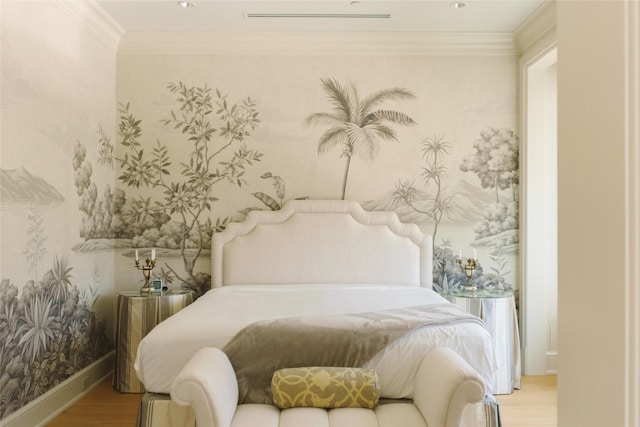 bedroom with wallpapered walls, baseboards, crown molding, and wood finished floors