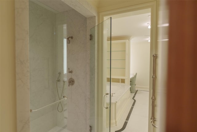 bathroom featuring a marble finish shower