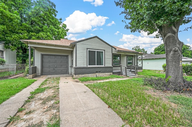 view of front facade with a garage and a front yard