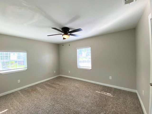 carpeted empty room with ceiling fan