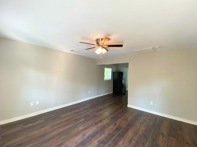 unfurnished room featuring ceiling fan and dark hardwood / wood-style floors