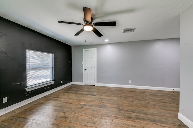 unfurnished room featuring hardwood / wood-style floors and ceiling fan