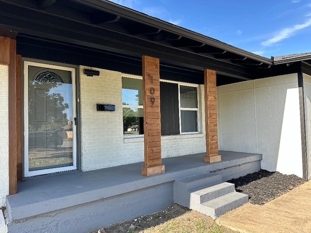 property entrance with covered porch