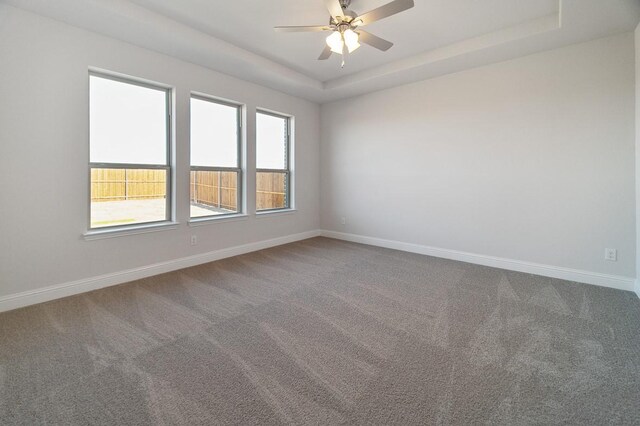 carpeted home office with ceiling fan