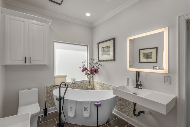 bathroom with tile patterned flooring, toilet, and crown molding