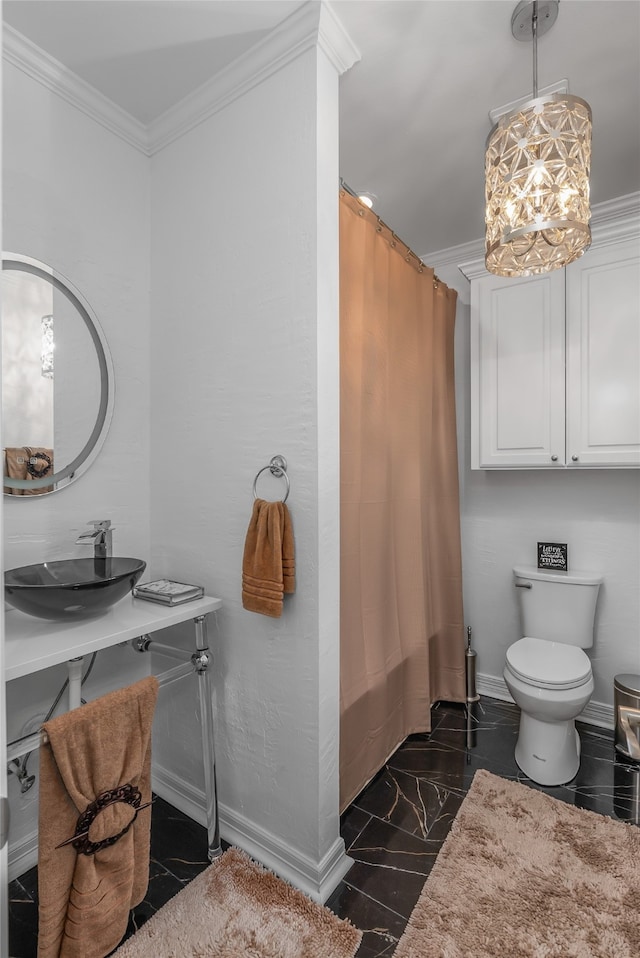 bathroom featuring sink, toilet, ornamental molding, and tile patterned floors