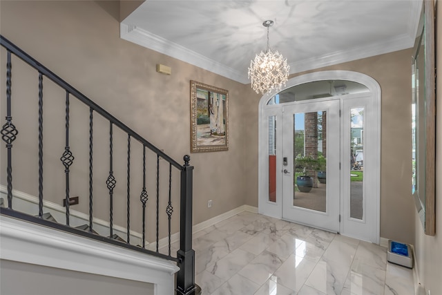 tiled foyer entrance with crown molding and an inviting chandelier