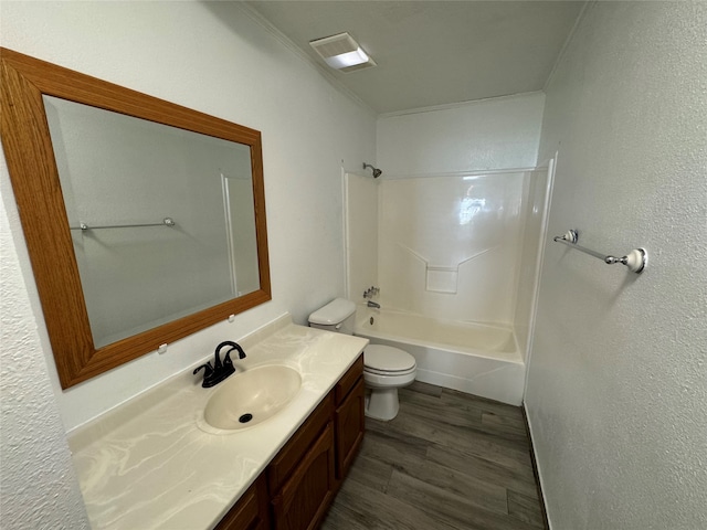 full bathroom featuring hardwood / wood-style flooring, vanity, shower / tub combination, and toilet