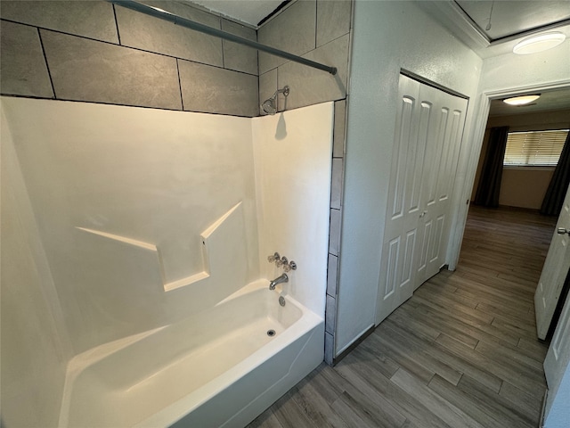 bathroom featuring shower / bathing tub combination and wood-type flooring