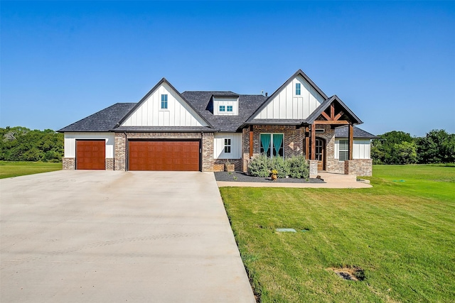 view of front facade featuring a front yard and a garage