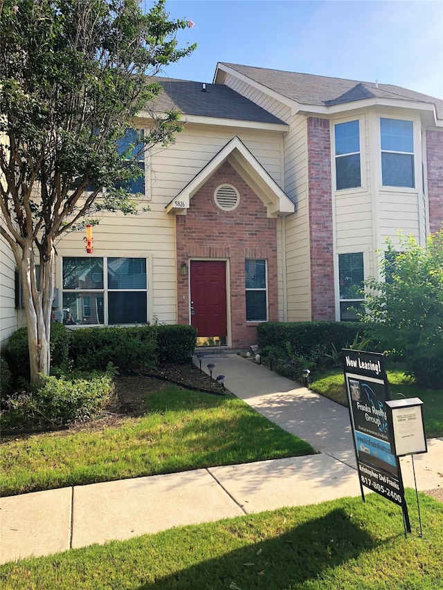 view of front of home with a front yard