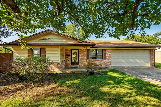 view of front of property featuring a garage and a front lawn