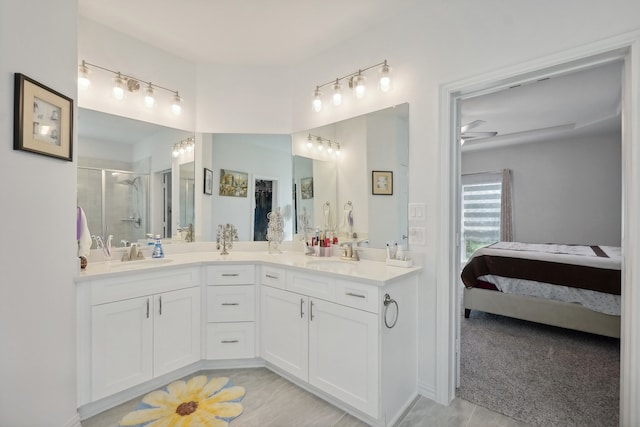 bathroom featuring ceiling fan, dual bowl vanity, and tile patterned floors