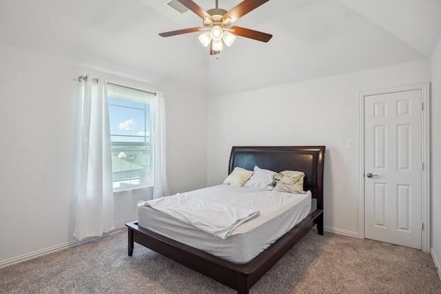 bedroom featuring ceiling fan, carpet floors, and lofted ceiling