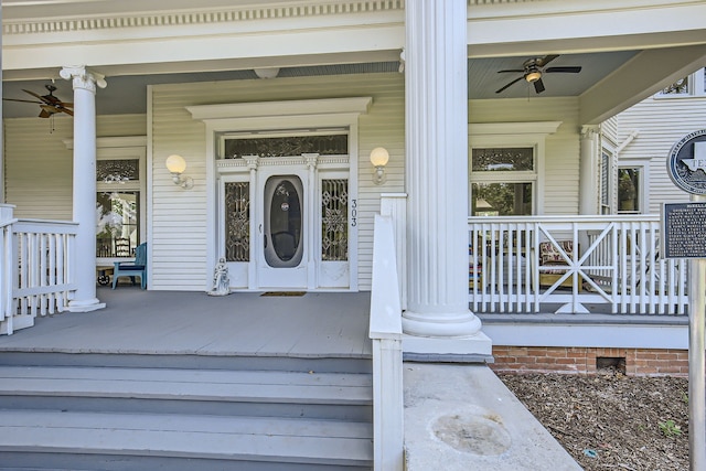 doorway to property with ceiling fan and a porch