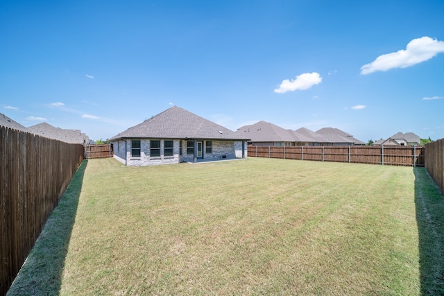 view of yard featuring a fenced backyard