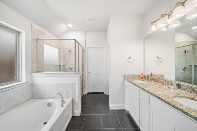 bathroom featuring vanity, an enclosed shower, lofted ceiling, and tile patterned floors