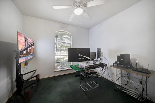 carpeted office featuring ceiling fan