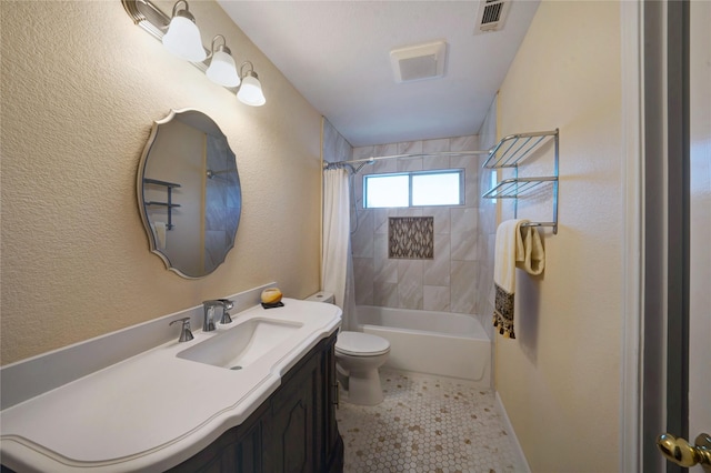 full bathroom featuring vanity, shower / tub combo with curtain, toilet, and tile patterned flooring