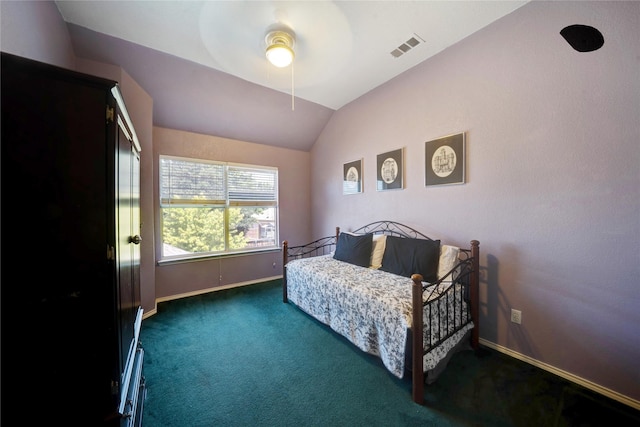 bedroom with vaulted ceiling, dark carpet, and ceiling fan