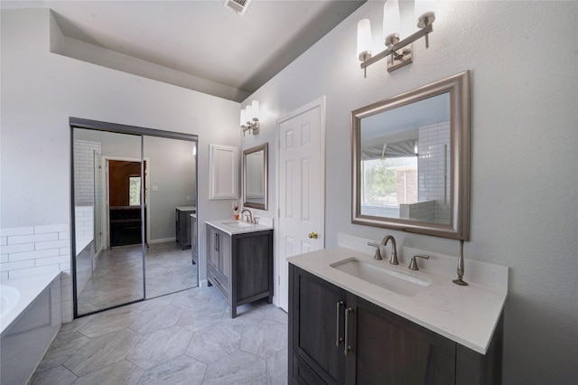 bathroom featuring vanity and a bathing tub