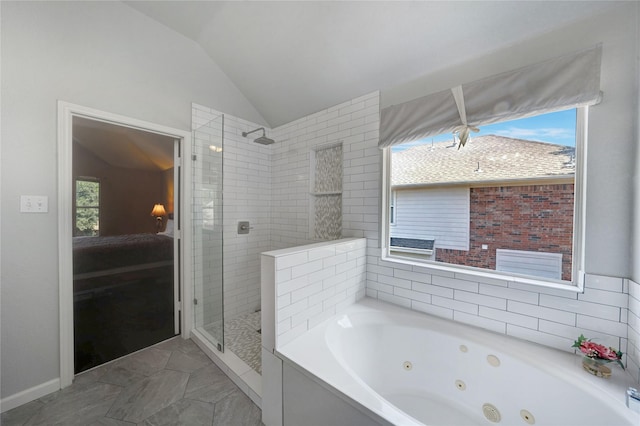 bathroom with plus walk in shower, plenty of natural light, and lofted ceiling