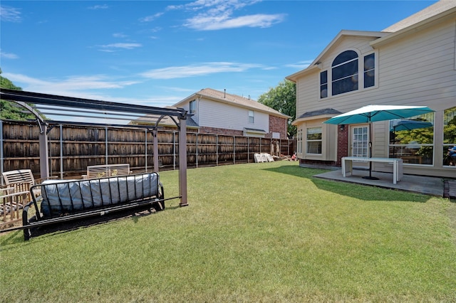 view of yard with a pergola and a patio area