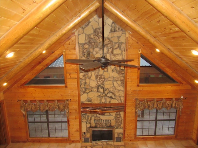 living room featuring wood ceiling, ceiling fan, and vaulted ceiling with beams