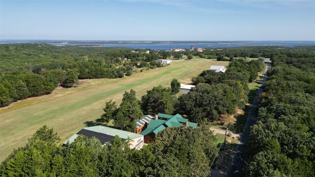 birds eye view of property with a water view and a rural view