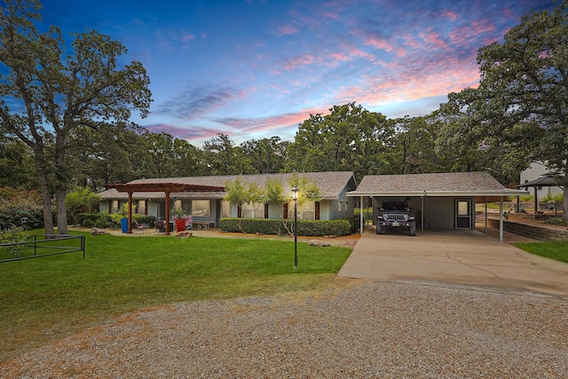 single story home with a yard and a carport