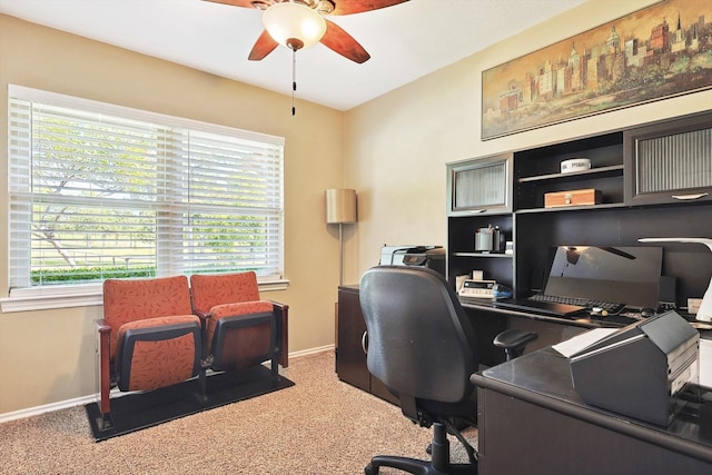 office area with carpet floors, ceiling fan, and a healthy amount of sunlight