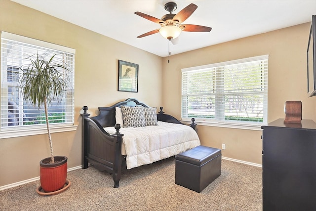 bedroom with ceiling fan and carpet flooring