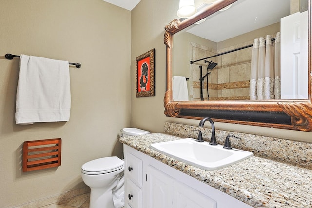 bathroom featuring toilet, vanity, tile patterned flooring, and curtained shower