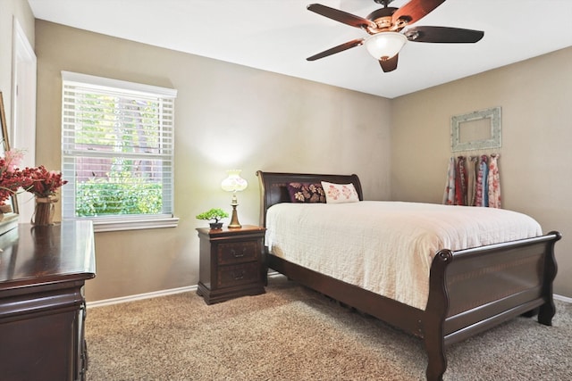 bedroom with ceiling fan and carpet