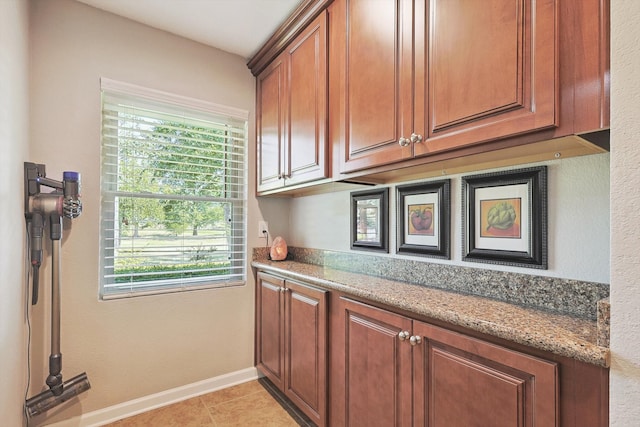 kitchen featuring light stone counters and light tile patterned floors