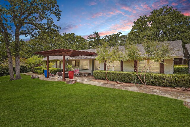 exterior space with a lawn and a patio