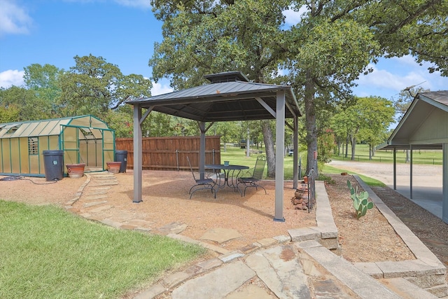 exterior space featuring a gazebo and an outdoor structure